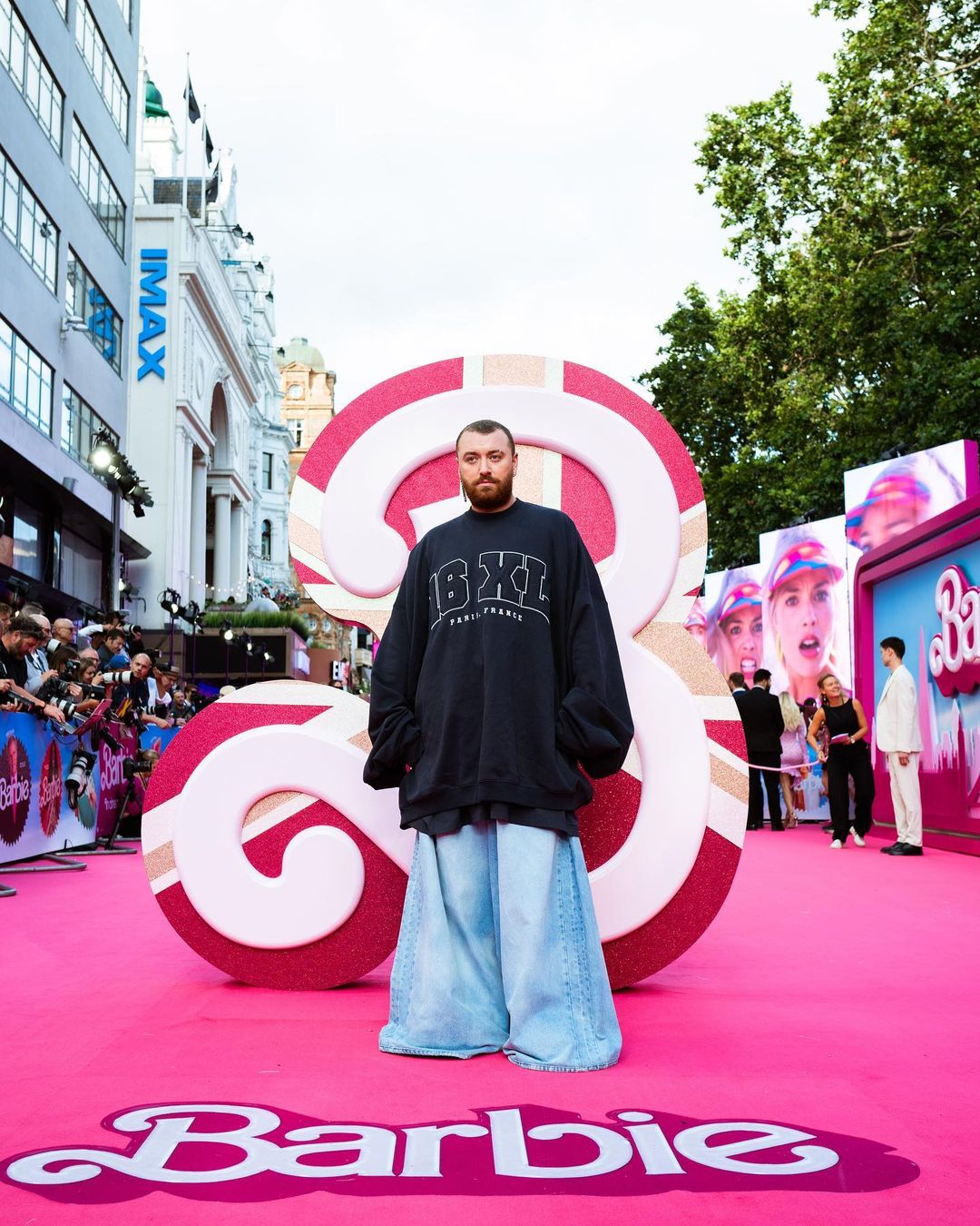Sam Smith wearing oversized 16XL clothes on the pink carpet