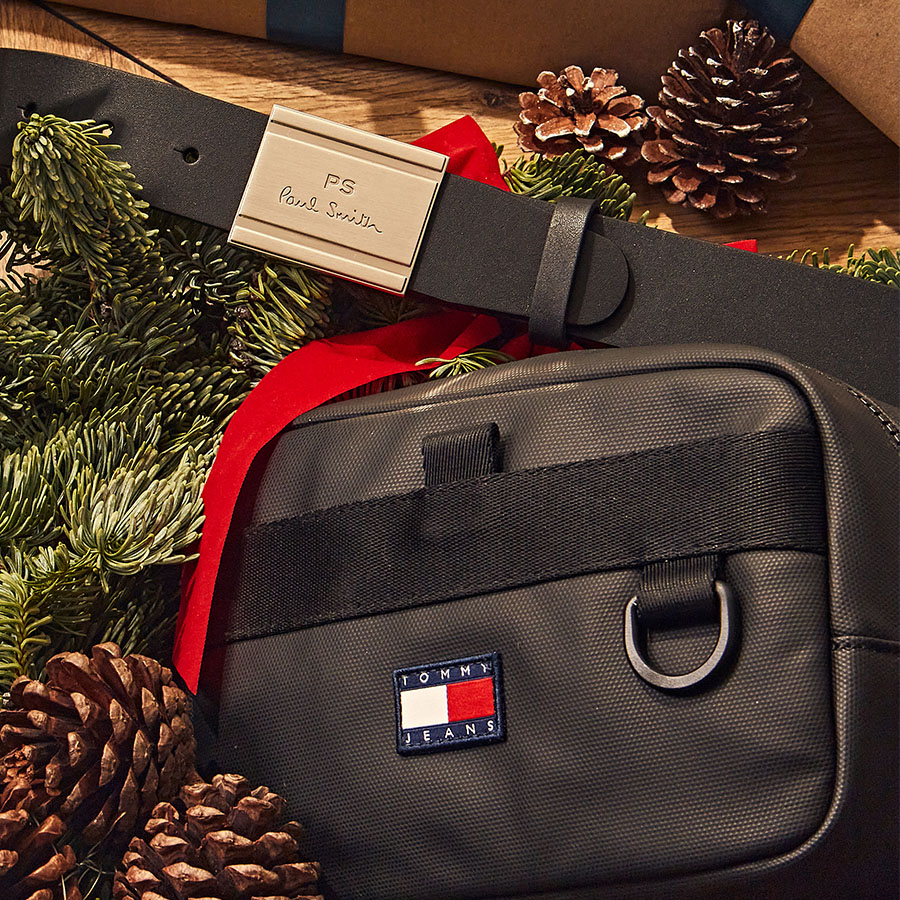 Designer gifts - a bag and a Paul Smith belt in a Christmas setting