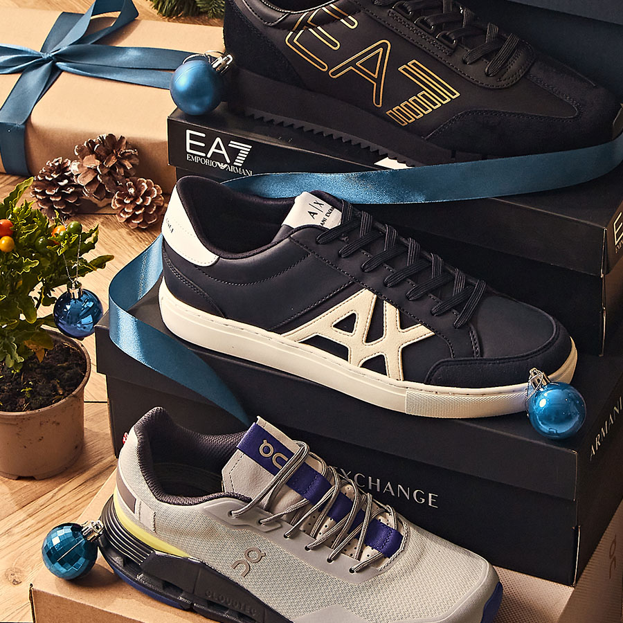 A selection of designer trainers with Christmas gift wrapping