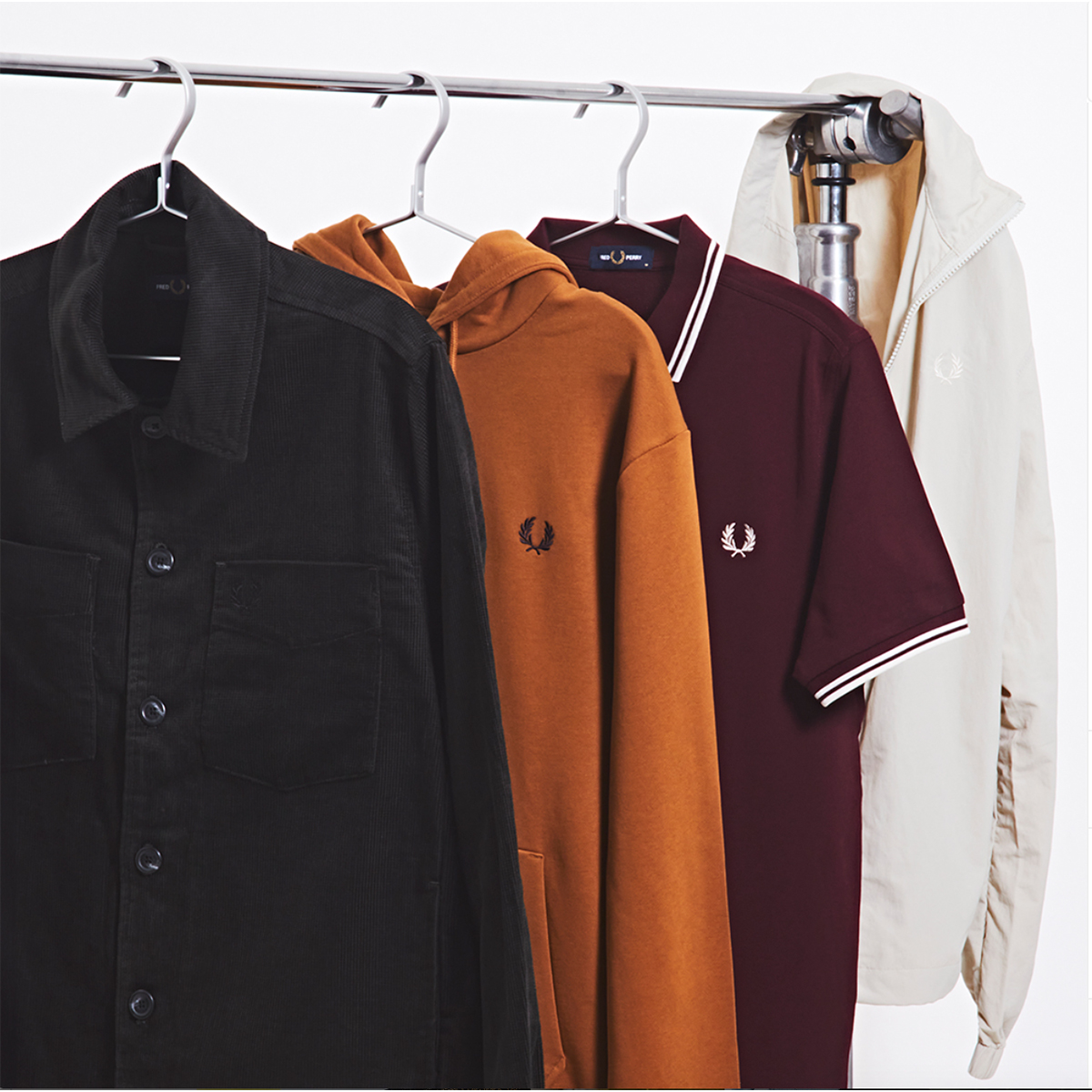 Fred Perry shirts hanging in a wardrobe