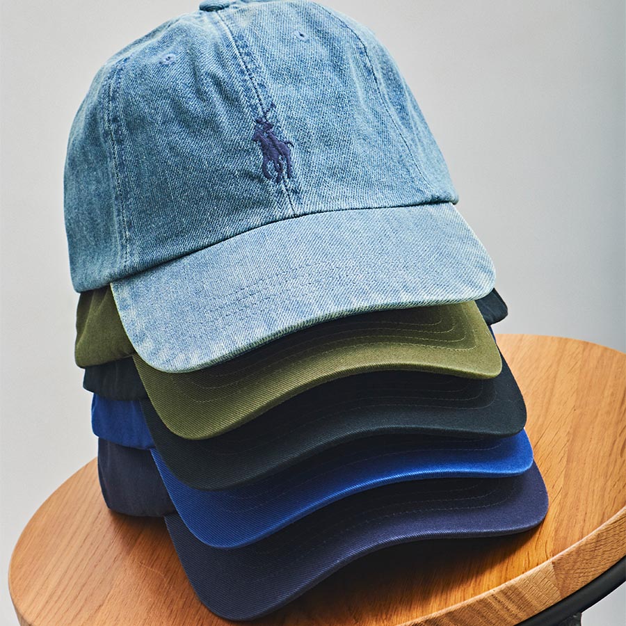 A stack of designer baseball caps