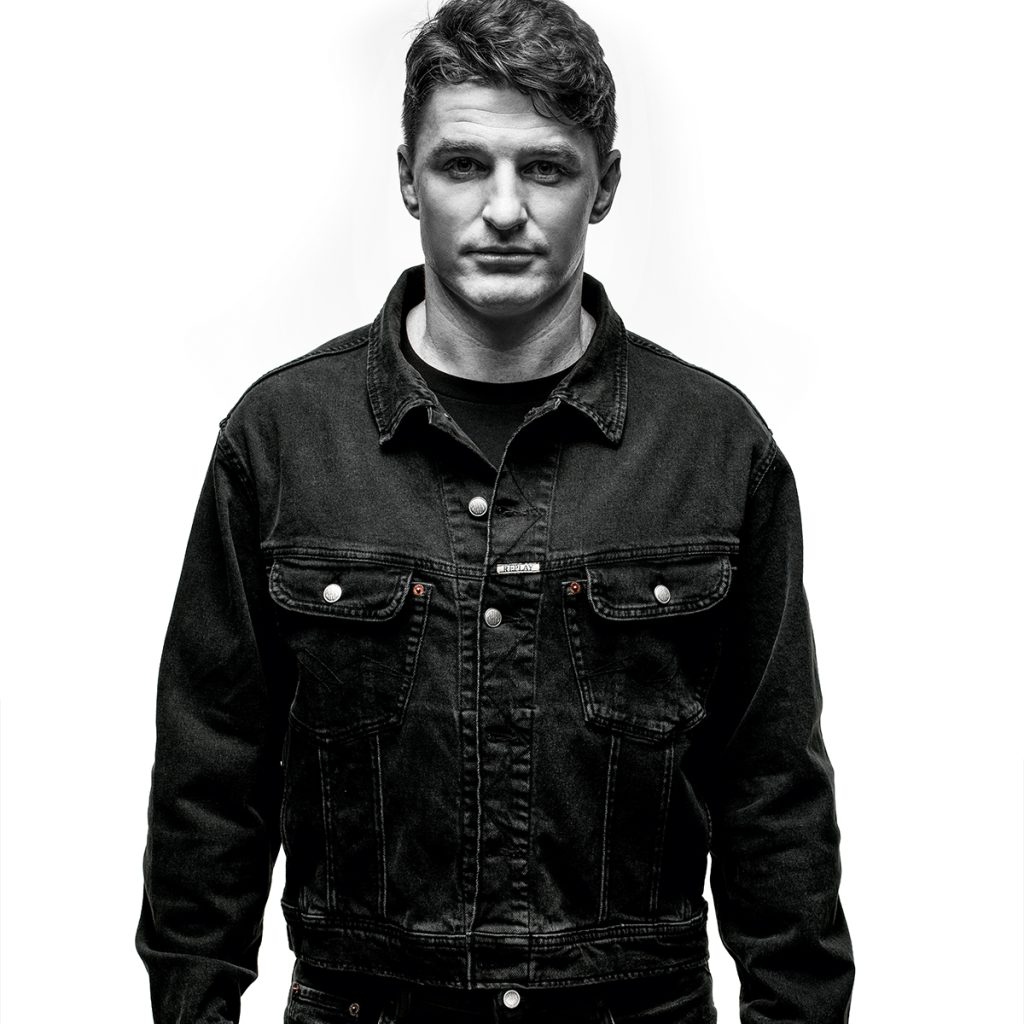 A man dressed in a black Replay denim jacket