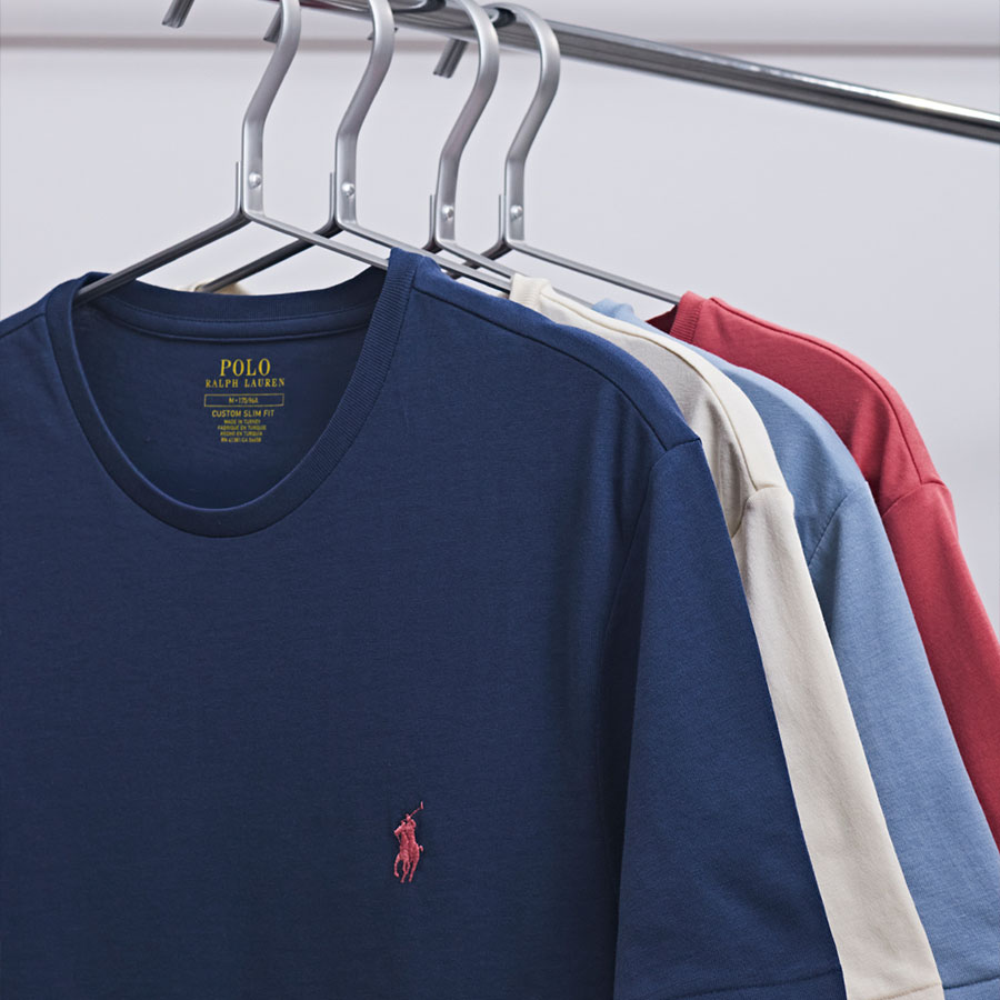 Four Ralph Lauren T Shirts hanging up