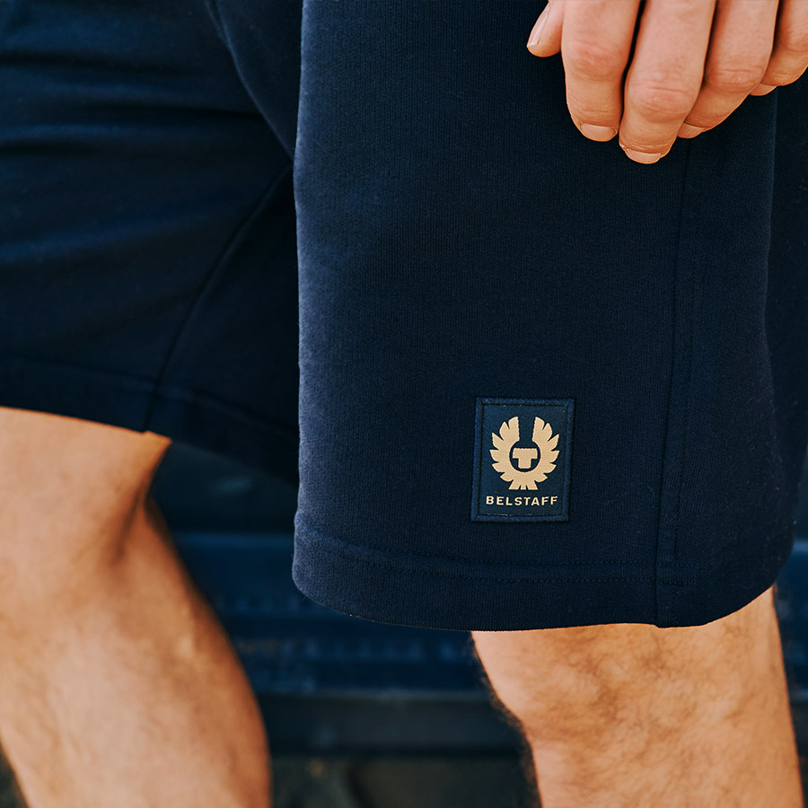 Close up view of a man wearing Belstaff jersey shorts