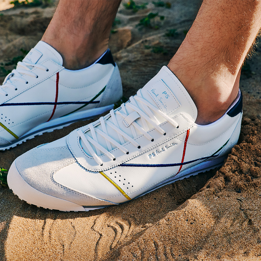 Feet in white trainers