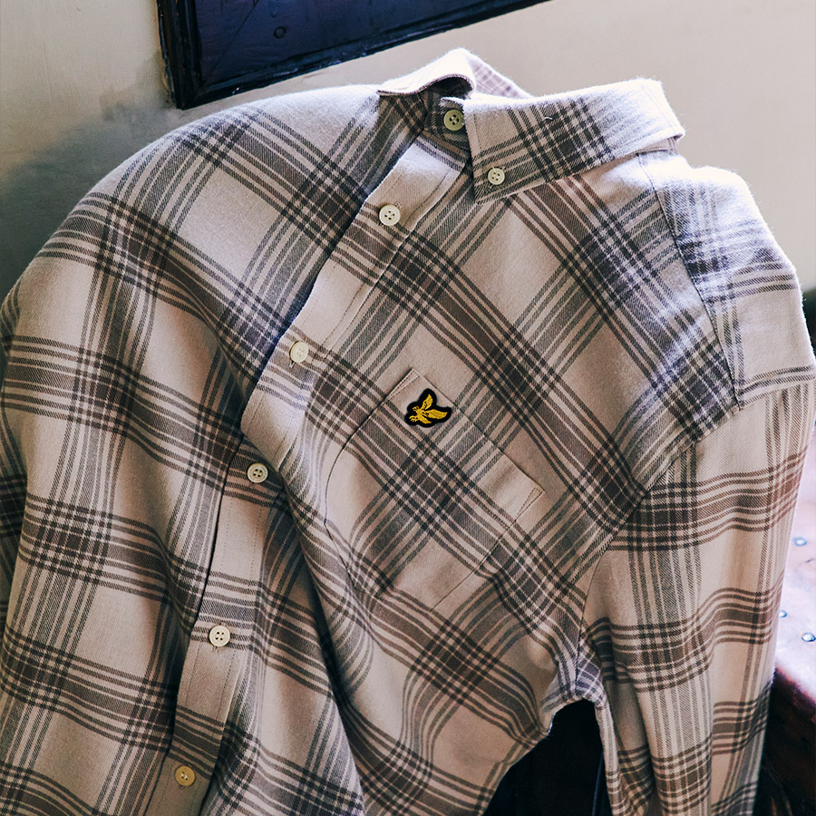 A checked shirt with a button down collar